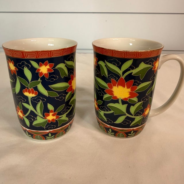 Set of RARE vintage Takahashi “Kashmir” porcelain mug(s) featuring a rich navy/blue ground with vibrant red, yellow, and...