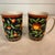 Set of RARE vintage Takahashi “Kashmir” porcelain mug(s) featuring a rich navy/blue ground with vibrant red, yellow, and...