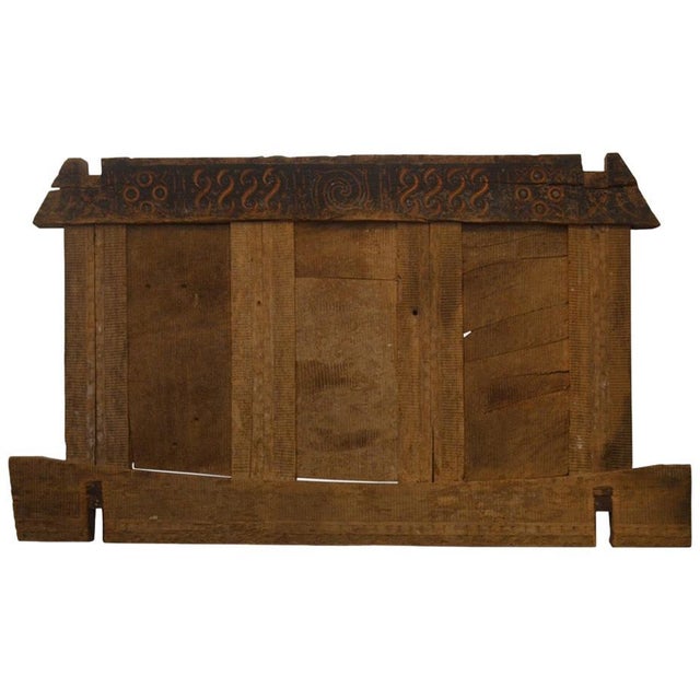 Ancient hand carved architectural panel from Toraja. The carving symbolizes the protection of the home and was used as an...
