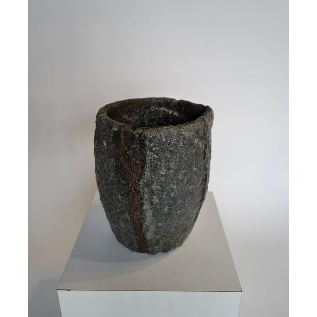 A Crucible transformed into a planter offers a unique and unconventional way to showcase plants and bring an Industrial...