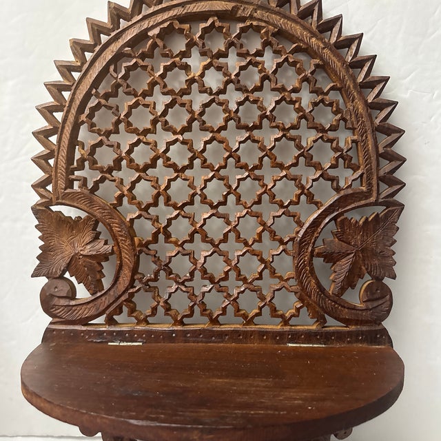 Hand made Indian Folding Shelf that features a fancy open work backing that you can see the small carving from the hand...