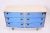 Blonde wood. Blue crystal glass. Brass Curved front commode with six drawers. In style of Gio Ponti and Pietro Chiesa...