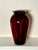 A deep rich ruby red color exudes from this clear glass vase. It’s bulbous shape with scalloped flat rimmed top makes it a...