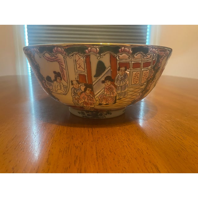 This vibrant hand-painted Chinese porcelain bowl brings elegant Chinoiserie charm to any interior. Likely dating from the...