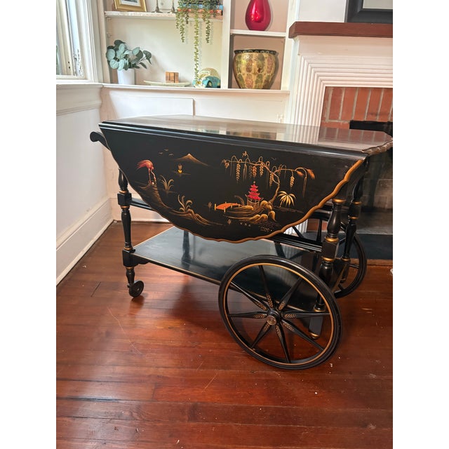 A showstopping piece from one of America’s most celebrated furniture makers. This rolling bar cart by Imperial Furniture...
