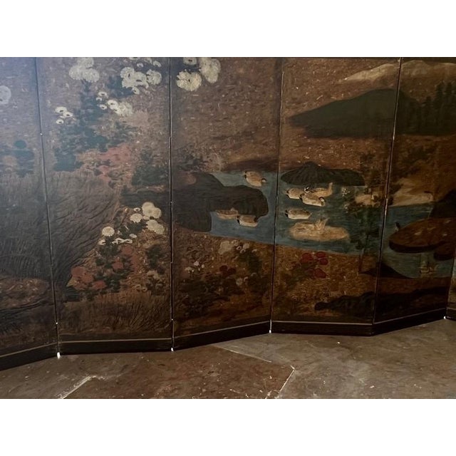 A 17th century Edo Period Japanese screen telling a pastoral story of white ducks floating on a blue stream surrounded by...