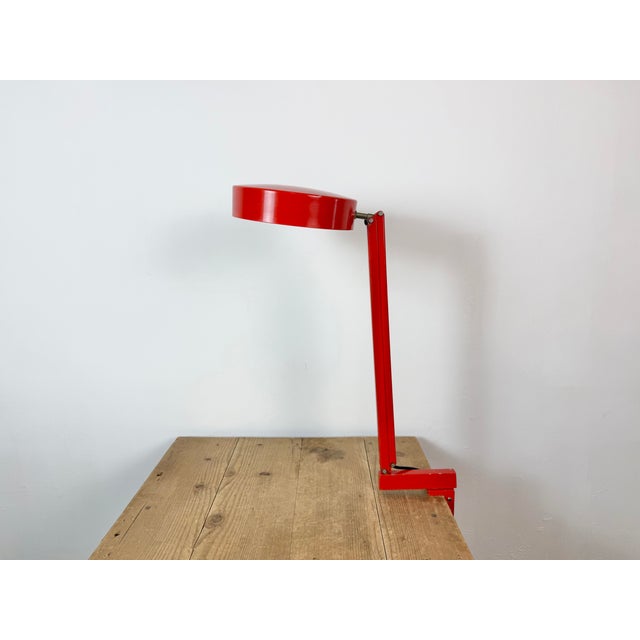 Vintage red adjustable table lamp made in former Czechoslovakia during the 1970s. Adjustable in all desired positions. It...