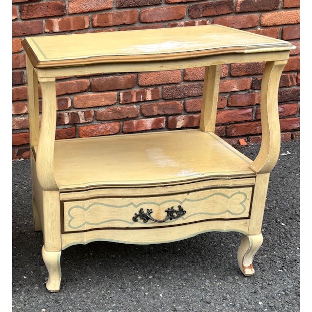 A pair of vintage John Widdicomb painter French Provincial side tables. Original condition with original hardware. Inside...