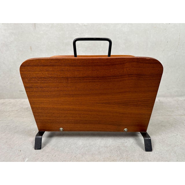 Vintage magazine rack made of teak and metal. 1950s. Designed by Cees Braakman for Pastoe. Height including bracket: 30...