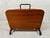 Vintage magazine rack made of teak and metal. 1950s. Designed by Cees Braakman for Pastoe. Height including bracket: 30...
