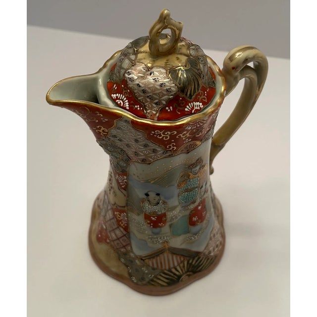 This is a Japanese Kutani hard paste porcelain chocolate pot, signed in red on the bottom. The pot can be used for tea or...