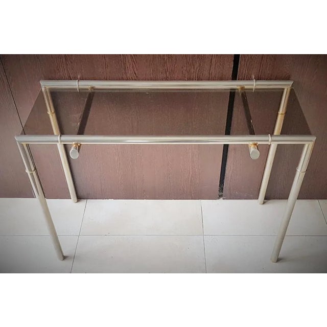 French console table made of nickel and smoked glass from the late 1960s. Sleek timeless design.