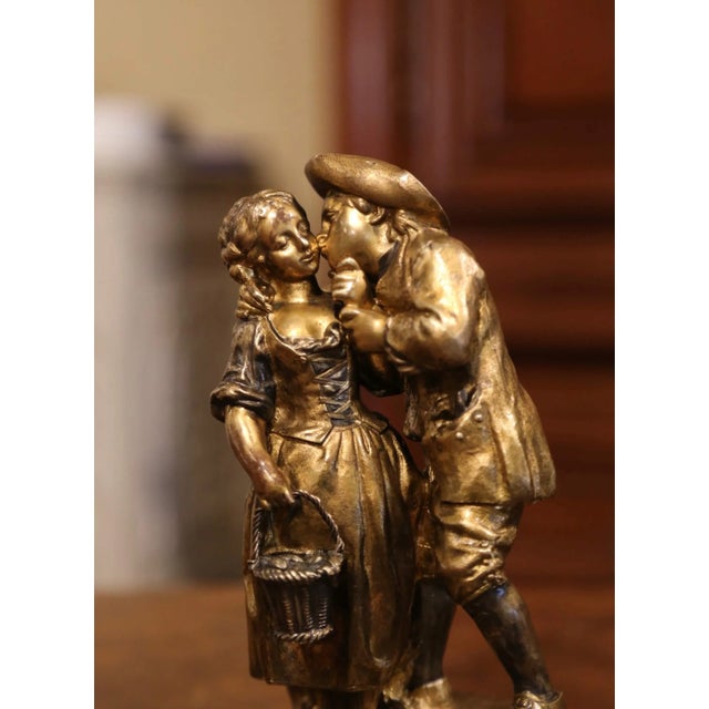 Decorate a shelf or a woman's writing table with this sweet antique figure composition "Le Baiser"; created in France...