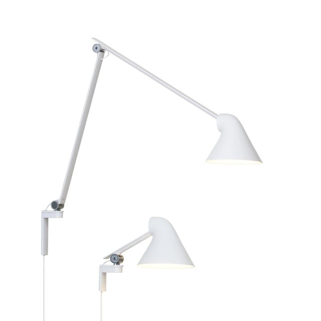 Oki Sato NJP white long wall light for Louis Poulsen. Designed by Oki Sato from Japan's Nendo design studio. Provides...