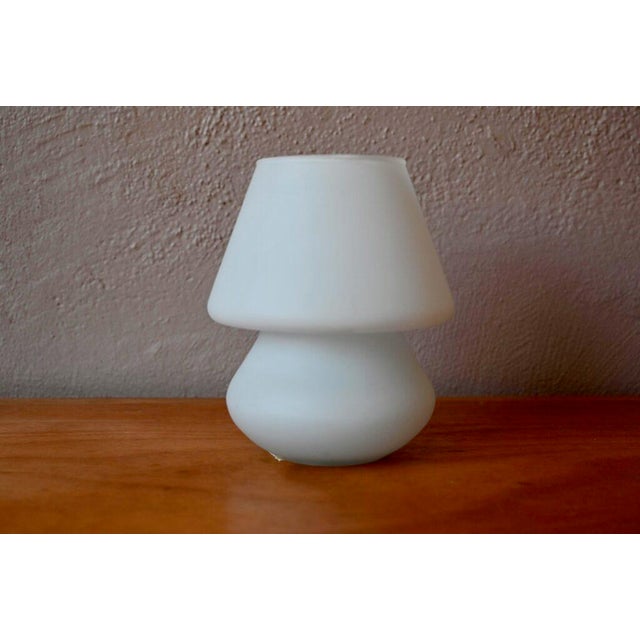 This bedside lamp or night light is made of stunning opaline glass, shaped like a bulbous mushroom. It diffuses a soft...