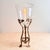 A genuinely rare and museum-quality Art Nouveau object — a brass tripod hurricane candleholder with its original hand-...