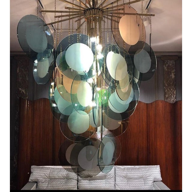 Large Chandelier in Brass with Smoked Murano Glass Discs, in Very Good conditions. Designed 1980 to 1989 I have official...