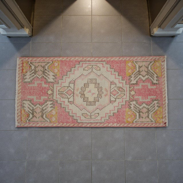 Vintage Turkish small rug from Oushak, Aegean, 1970s, featuring warm dusty rose tones and authentic village craftsmanship...