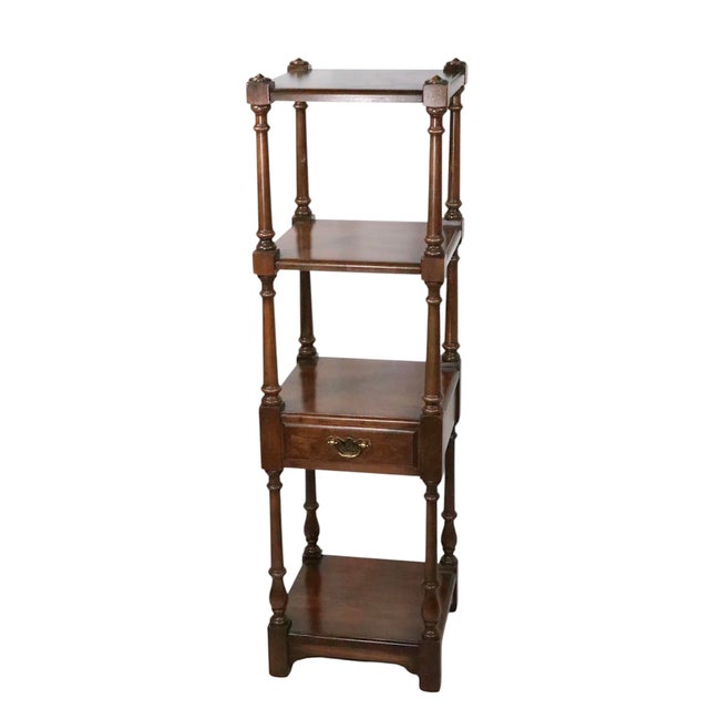 Classic tiered shelf limited edition stand by Pennsylvania House vintage 1970's. The table features four shelves, one...