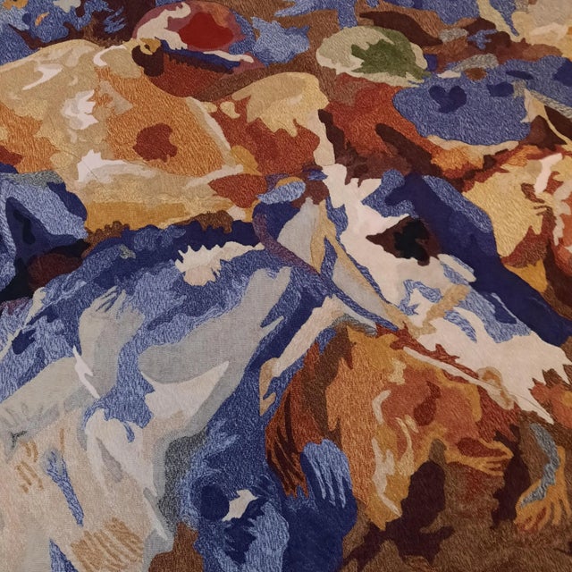 This large woolen carpet (240 x 170 cm) of a horse racing scene was likely based on a painting. The label on the back...