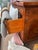 Bring old-world warmth and decorative craftsmanship into your space with this Vintage Marquetry Walnut Commode, likely a...
