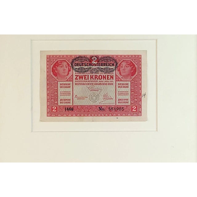 A framed Austro-Hungarian 2-crown banknote with "DEUTSCHÖSTERREICH" overstamp, circa 1917.