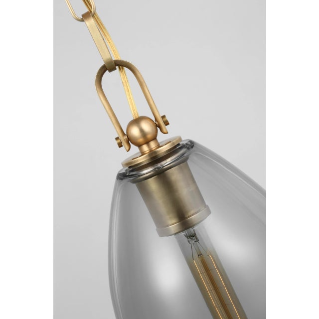Andros Medium Pendant in Antique-Burnished Brass with Smoked Glass Designer: Chapman & Myers Canopy: 5" Round Mounting:...