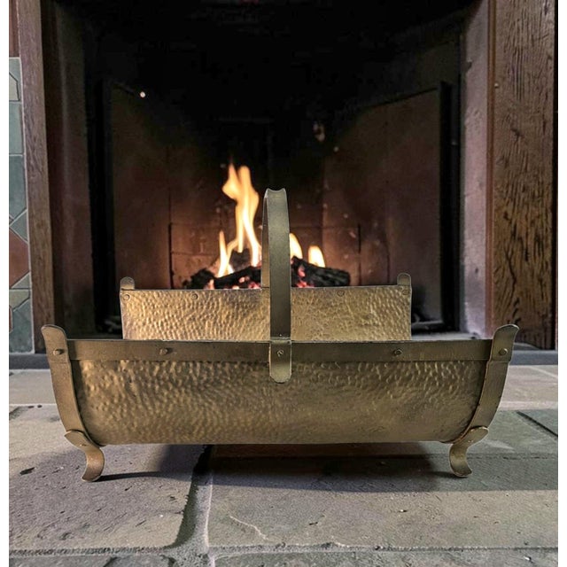 An early twentieth-century American fireplace log holder or firewood carrier dating to circa 1910–1930, constructed from...