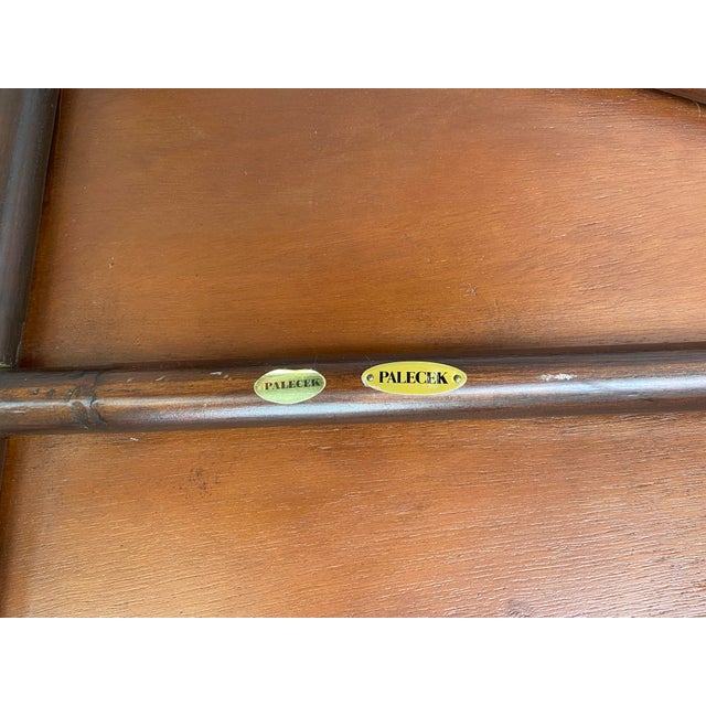 Asian- inspired two-tier curved bamboo and weaved rush side table.