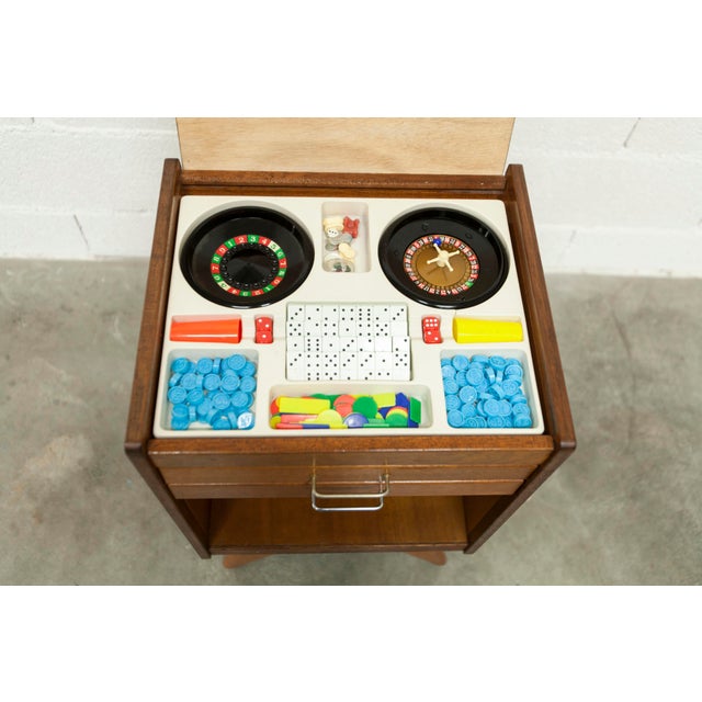 1960s Scandinavian style games bedside table with compass feet. It includes 12 old games, still relevant today. Checkers,...