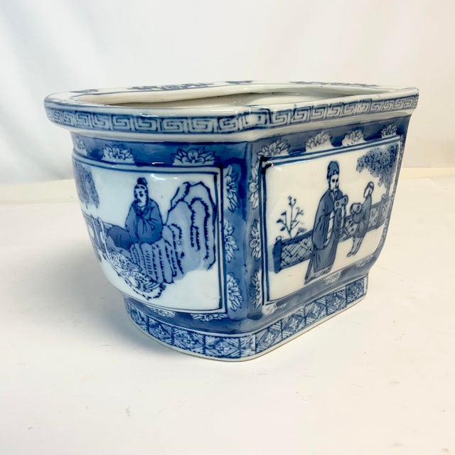 This is a hand-painted Chinoiserie Ceramic Planter from the Mid-Century. It’s unique in that all four side panels are...