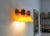 A pair of modern scandinavian vintage pine sconces/ wall lighing, which have a orange acrylic cone. The lamps are from to...