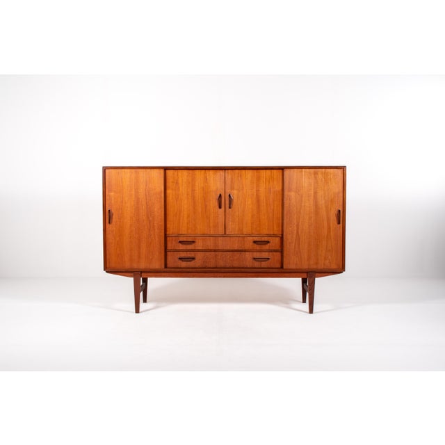 Refined Danish mid-century sideboard produced by P. Westergaard Møbelfabrik, crafted primarily in teak with elegant...