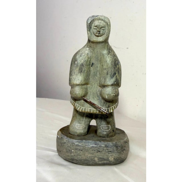 Up for sale is a nice quality hand carved antique Canadian Inuit soapstone Eskimo sculpture by Dimu. It's sculpted out of...