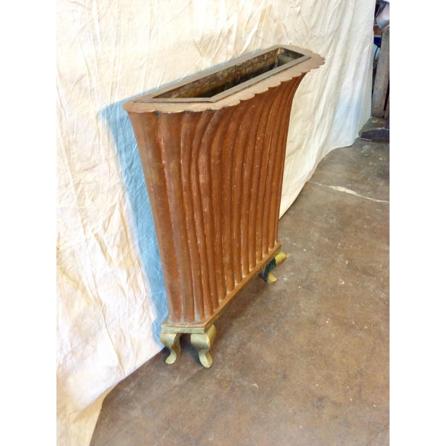 Found in the South of France, this artisan made Early 20th Century French Copper and Brass Umbrella Plant Stand features a...