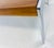 This is a mid-century vintage dark walnut and chrome coffee table after Milo Bowman. This coffee table has modern chrome...