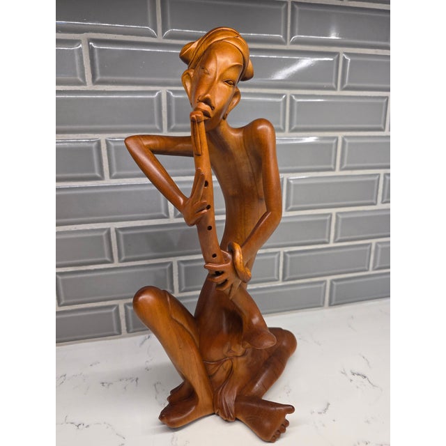 An absolute museum-grade masterpiece of mid-century Balinese modernism, this striking 14¾-inch sculpture depicts a...