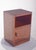 Bedside table with one door. Its cubic and compact structure emphasises simple and practical geometry, evoking a modernist...