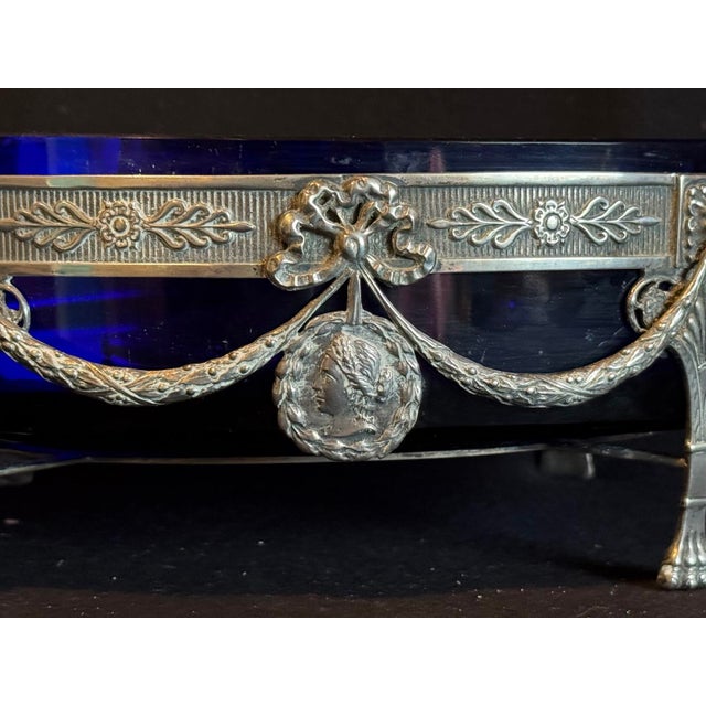 A refined 19th-century European sterling silver jardiniere bowl, designed in the elegant Louis XVI neoclassical style and...