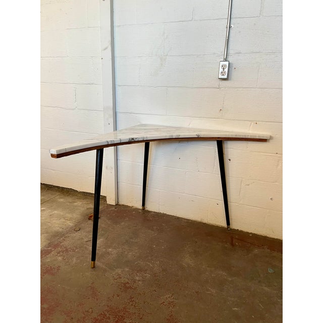 Unique bespoke curved marble corner or sofa table. Sleek and slender. Beautifully grained marble sits atop tripod legs.