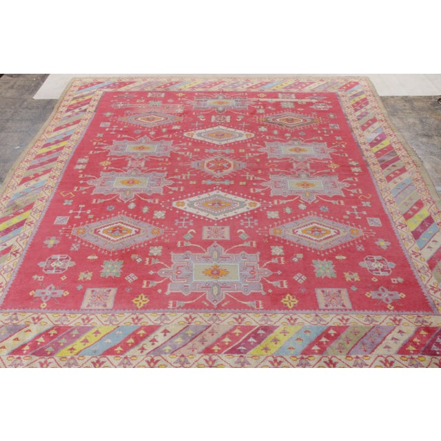 Hand knotted in soft, yet durable wool, an antique Agra rug from the 1920s originating from India—now joining Rug &...