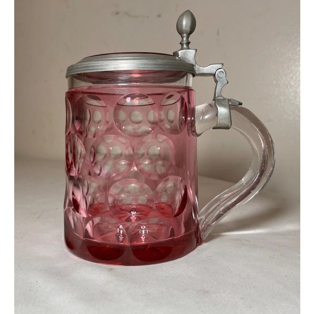 Up for sale is a high quality antique cut to clear bohemian Czech lidded glass beer stein. It's made out of thick ruby red...