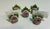 A beautiful set of nine vintage German porcelain place card holders featuring hand-sculpted pink roses purple flowers with...