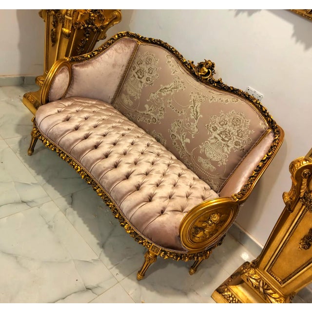 This elegant French Rococo-inspired sofa features a sophisticated combination of soft beige velvet and patterned damask...