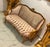 This elegant French Rococo-inspired sofa features a sophisticated combination of soft beige velvet and patterned damask...