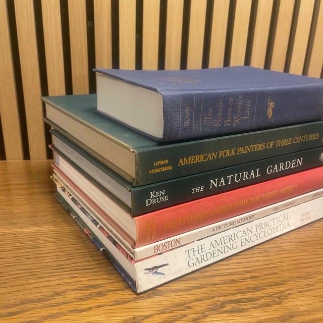 A richly toned decorative book vignette anchored in classic garden, Americana, and literary references—curated for instant...