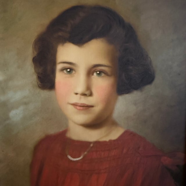 This lovely early 20th-century portrait painting depicts a young girl in a vibrant red dress with neclace. The painting is...