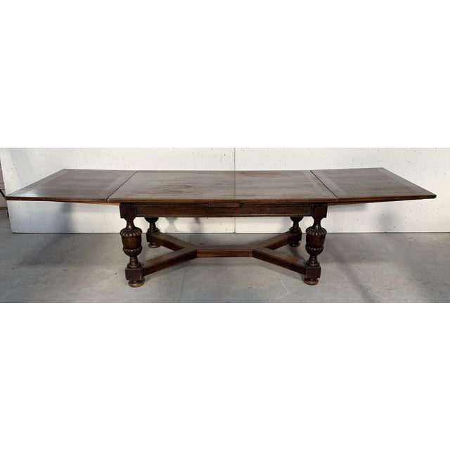 Large renaissance-style oak dining table four baluster legs with x-shaped stretchers two italian-style extension leaves...
