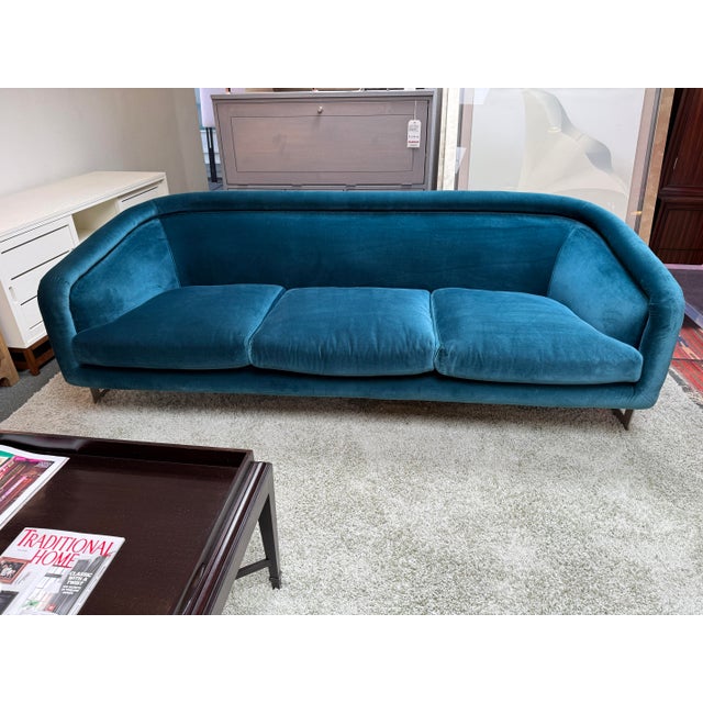 Design Plus Gallery presents the Bacharach Peacock Blue Velvet Sofa from Jonathan Adler. This sofa is sculptural enough to...