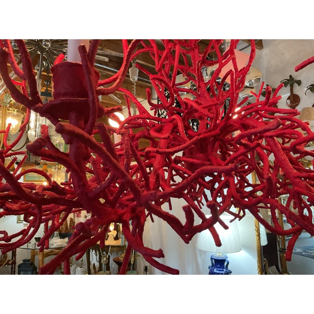 A dramatic sculptural chandelier inspired by the organic branching forms of natural coral. The fixture features an...